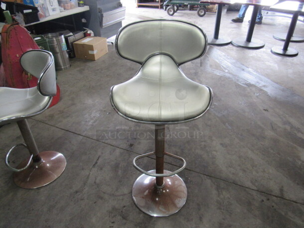One Retro Look Adjustable Height Chrome Cushioned Swivel Bar Stool With Footrest. 