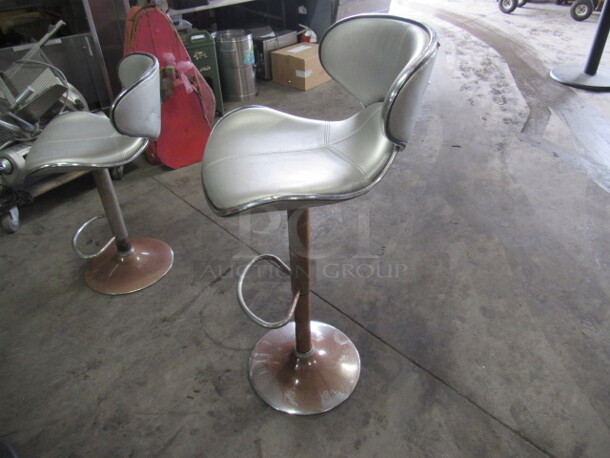 One Retro Look Adjustable Height Chrome Cushioned Swivel Bar Stool With Footrest. 