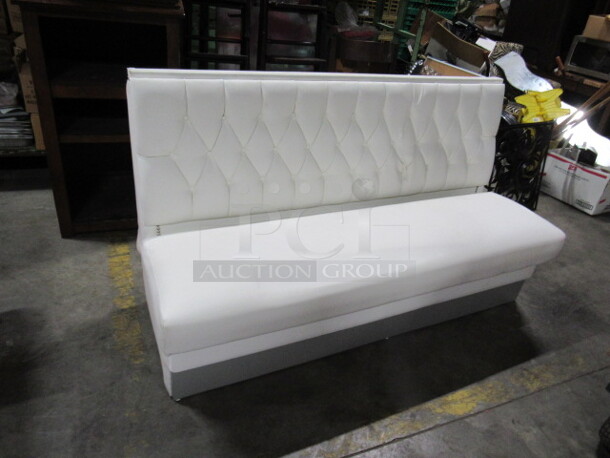 One Single Sided Booth With White Cushioned Seat And Back. 64X26X37