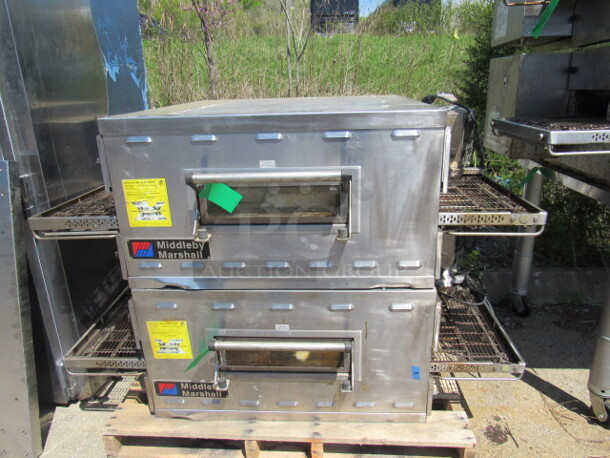 Double Stack Middleby Marshall  natural gas conveyor Pizza Oven With Stainless Steel Table And 4 LEGS, With Casters, Must Assemble Table. Model# PS536G. 61X44X63. WORKING WHEN REMOVED!!! DOUBLE STACK2 PIZZA OVENS MAKE 1 UNIT! 2XBID YOU WILL GET 1 DOUBLE STACK UNIT!!!! $27,423.00. - Image 1 of 5