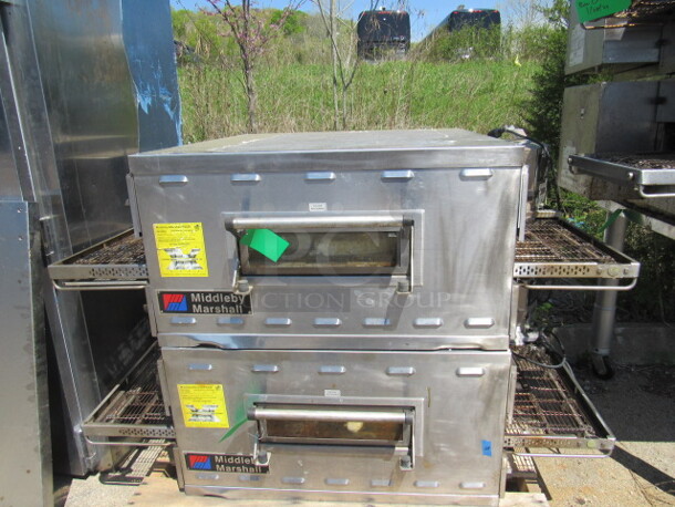 Double Stack Middleby Marshall  natural gas conveyor Pizza Oven With Stainless Steel Table And 4 LEGS, With Casters, Must Assemble Table. Model# PS536G. 61X44X63. WORKING WHEN REMOVED!!! DOUBLE STACK2 PIZZA OVENS MAKE 1 UNIT! 2XBID YOU WILL GET 1 DOUBLE STACK UNIT!!!! $27,423.00. - Image 2 of 5