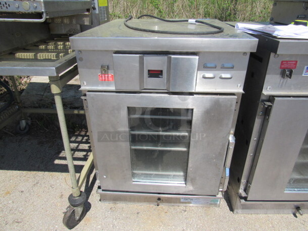 One Winston Holding Cabinet. Model# HA4509ZE. 120 Volt. 27X33X37. Working When Removed. 