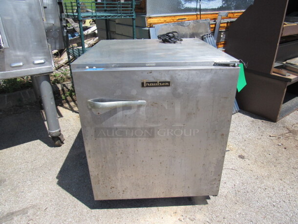 One Stainless Traulsen Under Counter Refrigerator With 1 Rack On Casters. Model# UHT-27. 125 Volt. 27X30X32. Working.