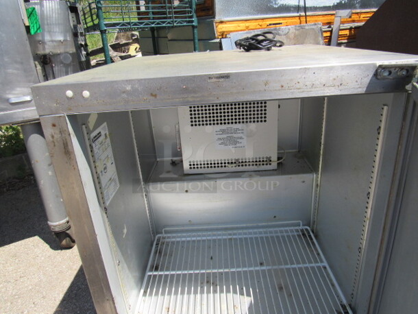 One Stainless Traulsen Under Counter Refrigerator With 1 Rack On Casters. Model# UHT-27. 125 Volt. 27X30X32. Working. - Image 2 of 2