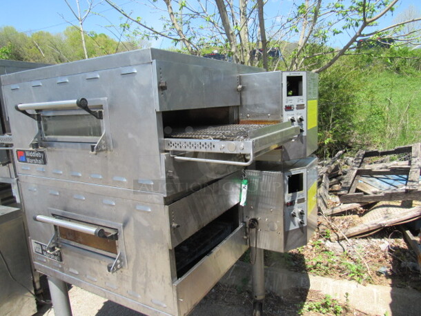 Double Stack Middleby Marshall Electric Conveyor Pizza Ovens On SS Table With Casters. Model# PS536E. CONTROLLERS HAVE BEEN REMOVED. 208 Volt. 3 Phase. DOUBLE STACK 2 PIZZA OVENS MAKE 1 UNIT. 2XBID. YOU WILL GET 1 DOUBLE STACK UNIT!!!! 61X44X63. - Image 2 of 5