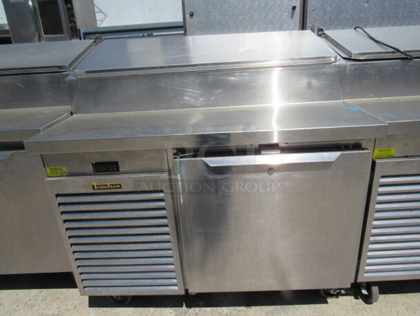 One Traulsen 1 Door Refrigerated Pizza Prep Table On Casters, With 1 Rack. Model# TS048HT. 115 Volt. 48X35X49. $9504.00. WORKING! - Image 1 of 3