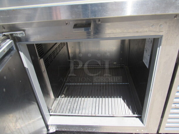 One Traulsen 1 Door Refrigerated Pizza Prep Table On Casters, With 1 Rack. Model# TS048HT. 115 Volt. 48X35X49. $9504.00. WORKING! - Image 2 of 3