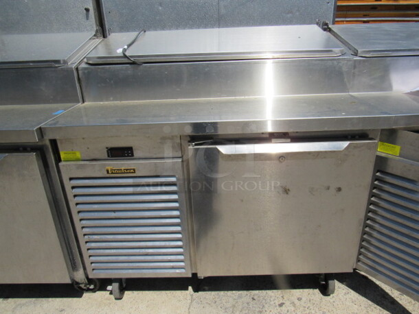 One Traulsen 1 Door Refrigerated Pizza Prep Table On Casters, With 1 Rack. Model# TS048HT. 115 Volt. 48X35X49. $9504.00. WORKING!