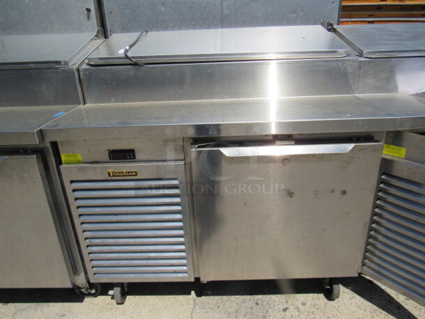One Traulsen 1 Door Refrigerated Pizza Prep Table On Casters, With 1 Rack. Model# TS048HT. 115 Volt. 48X35X49. $9504.00. WORKING! - Image 1 of 4