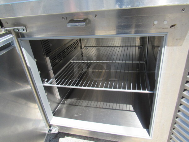 One Traulsen 1 Door Refrigerated Pizza Prep Table On Casters, With 1 Rack. Model# TS048HT. 115 Volt. 48X35X49. $9504.00. WORKING! - Image 2 of 4