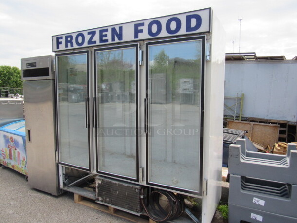 One 3 Door Glass Display Freezer. 115 Volt. Model# CF74-SW. 76X32X84. Missing Bottom Panel Not Working.