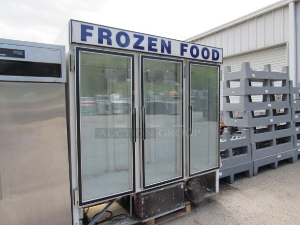 One 3 Door Glass Display Freezer. 115 Volt. Model# CF74-SW. 76X32X84. Missing Bottom Panel Not Working. - Image 2 of 4