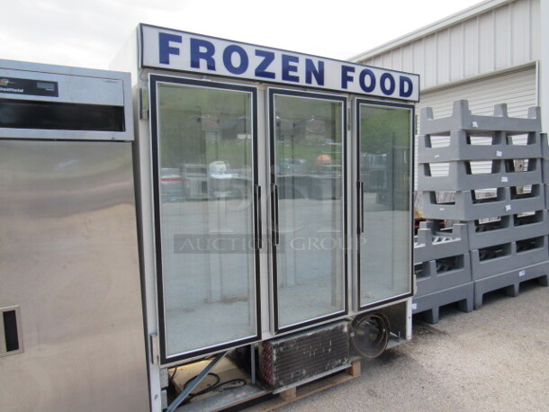 One 3 Door Glass Display Freezer. 115 Volt. Model# CF74-SW. 76X32X84. Missing Bottom Panel Not Working. - Image 4 of 4