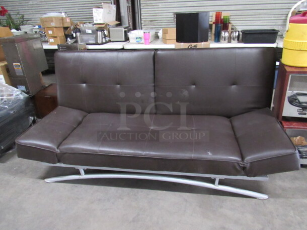 One Brown Cushioned Futon With A Metal Frame. 80X40X36