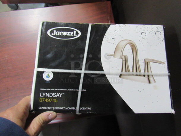 One NEW Jacuzzi Lyndsay Faucet With A Brushed Nickel Finish. #1749745.