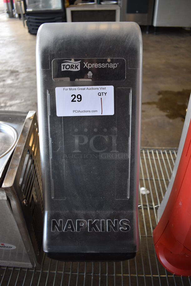 Tork Xpressnap Black and Clear Poly Countertop Napkin Dispenser. 7.5x11x22.5 - Image 1 of 3