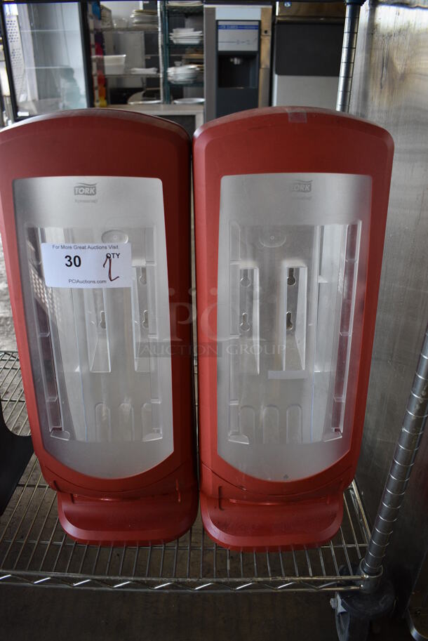 2 Tork Red and Clear Poly Countertop Napkin Dispensers. 9x9x24.5. 2 Times Your Bid!