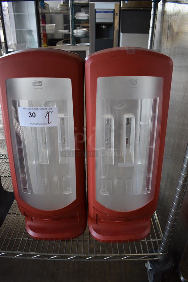 2 Tork Red and Clear Poly Countertop Napkin Dispensers. 9x9x24.5. 2 Times Your Bid! - Image 1 of 4