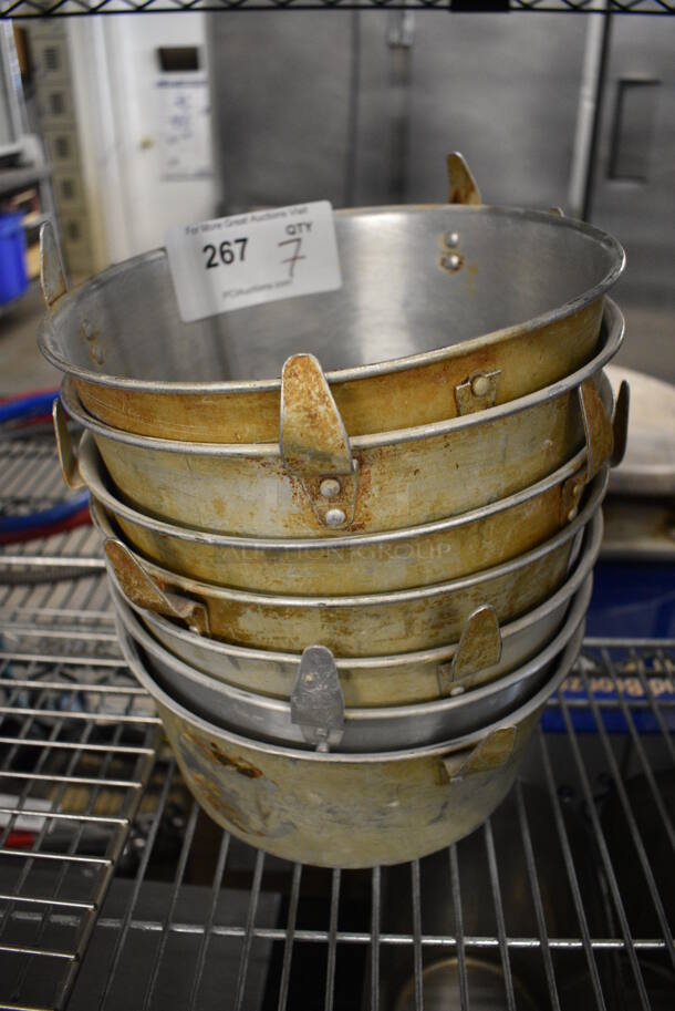 7 Metal Bundt Cake Pans. Does Not Have Middle Piece. 10x10x4. 7 Times Your Bid!