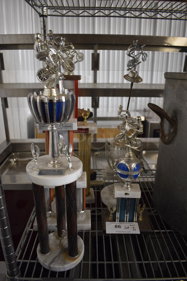 ALL ONE MONEY! Lot of 7 Various Metal Trophies! Includes 5x5x21 - Image 1 of 5