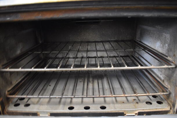 Garland Stainless Steel Commercial Propane Gas Powered 4 Burner Range w/ Oven and Backsplash. 30x32x43 - Image 6 of 10