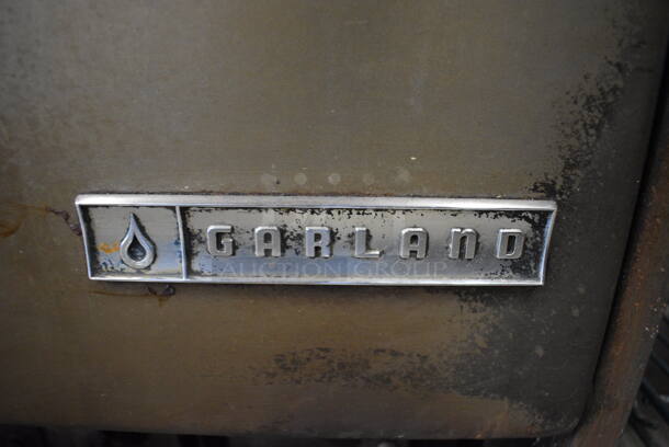 Garland Stainless Steel Commercial Propane Gas Powered 4 Burner Range w/ Oven and Backsplash. 30x32x43 - Image 7 of 10