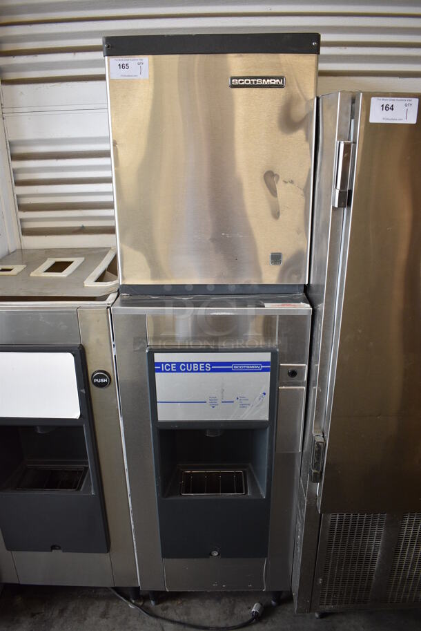 	WOW! Scotsman Model CME306WS-1H Stainless Steel Commercial Water Cooled Ice Head on Scotsman Model HD156S-1A Stainless Steel Commercial Floor Style Hotel Ice Dispenser. 115 Volts, 1 Phase. 22x30x78