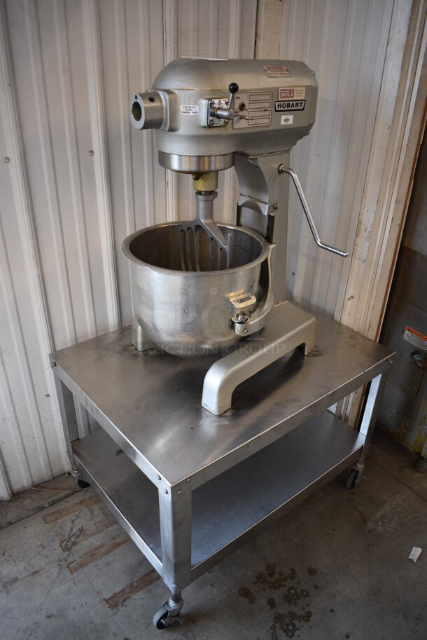 BEAUTIFUL! Hobart Model A200 Metal Commercial Countertop 20 Quart Planetary Mixer w/ Stainless Steel Mixer and Paddle Attachment on Stainless Steel Equipment Stand w/ Commercial Casters. 115 Volts, 1 Phase. 17x20x31, 24.5x32.5x21.5. Tested and Working!