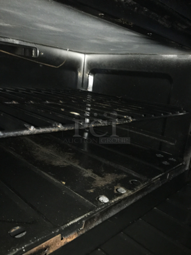 AMAZING! Garland Commercial 6 Burner Stove! With 2 Full Size Ovens Underneath! With Right Side Flat Griddle/Cheese Melter Combo! With Overhead Salamander! All Stainless Steel! On Casters! - Image 6 of 11