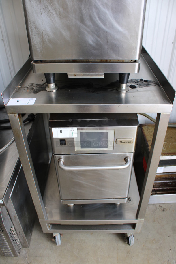 Stainless Steel Commercial 2 Tier Equipment Table on Commercial Casters. Goes GREAT w/ Item # 4-5! 24x30x43 - Image 1 of 4