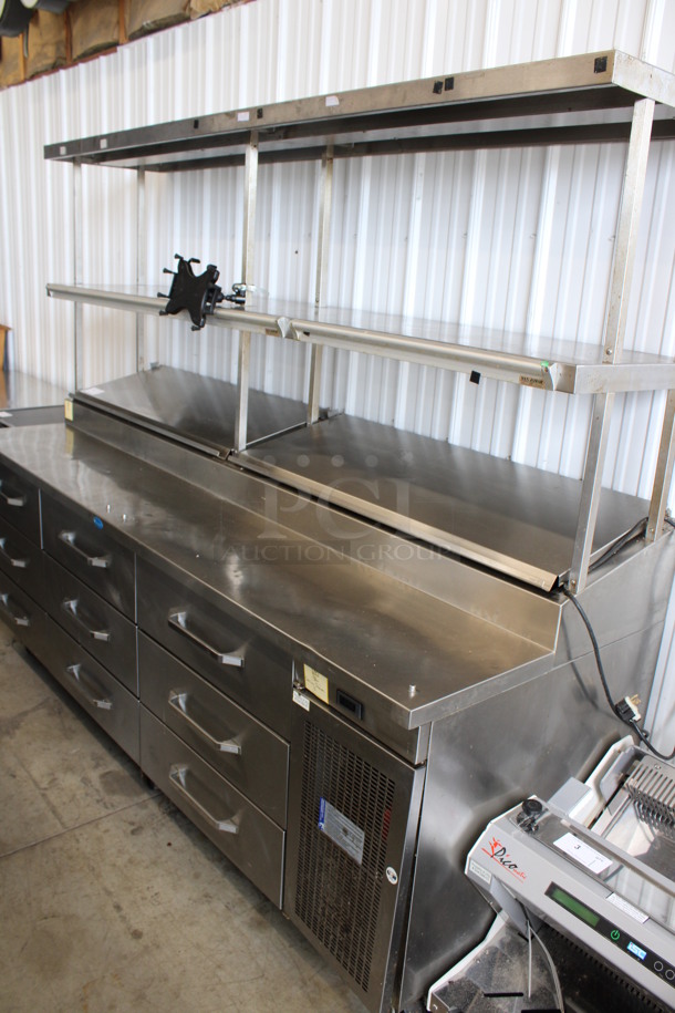 WOW! Randell Stainless Steel Commercial Pizza Prep Table w/ 2 Lids, 9 Drawers, 2 Check Order Holding Rods and Double Over Shelf on Commercial Casters. 125 Volts, 1 Phase. 95x34x77. Tested and Powers On But Does Not Get Cold