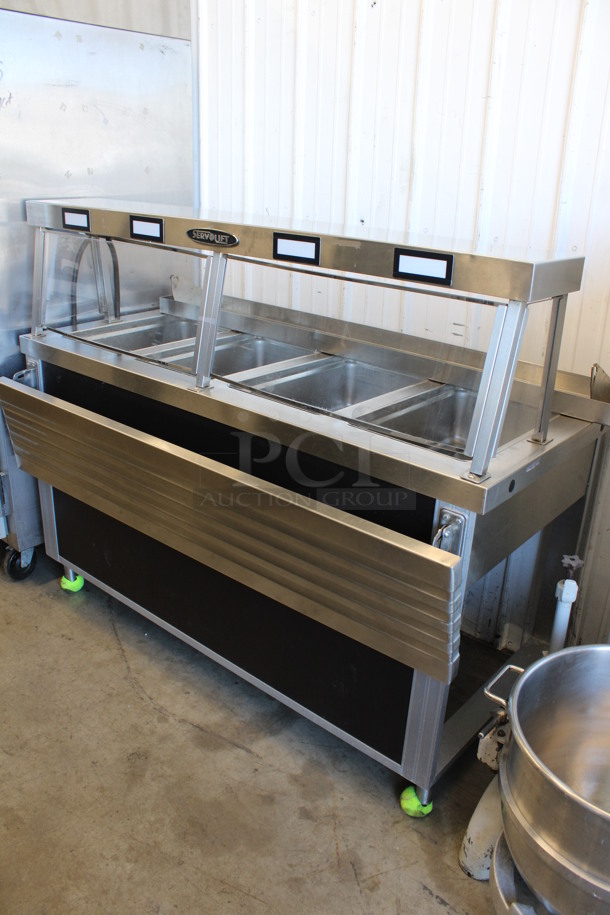 Servolift Eastern Model 501-4 Stainless Steel Commercial Electric Powered 4 Bay Steam Table w/ Sneeze Guard and Tray Slide. 120/208 Volts, 1 Phase. 62x35x52