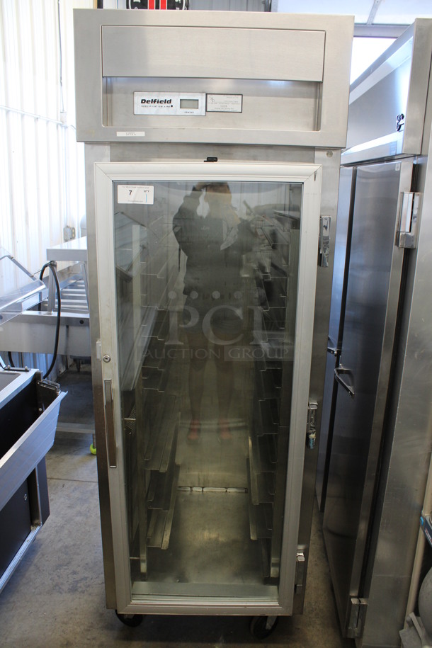 Delfield Model SLH29-G Stainless Steel Commercial Single Door Reach In Cooler Merchandiser on Commercial Casters. 115/208-230 Volts, 1 Phase. 29x35x85