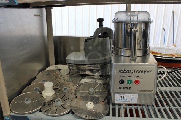 Robot Coupe Model R 302 Stainless Steel Commercial Countertop Food Processor w/ Metal Bowl, Poly Lid, Extra Lid, 2 S Blades, 6 Slicing Blades, 4 Grating Blades. 115 Volts, 1 Phase. 8x12x18. Tested and Working!