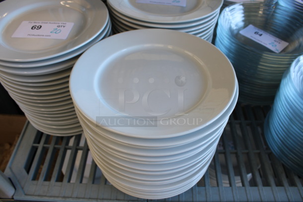 23 White Ceramic Plates. 9x9x1. 23 Times Your Bid!