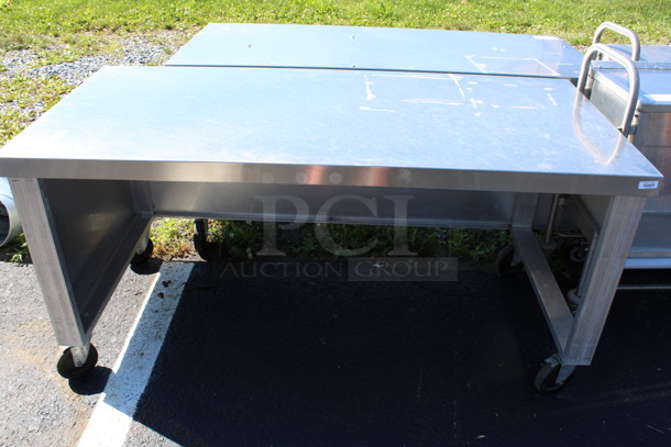 Stainless Steel Commercial Table on Commercial Casters. 62x29x30