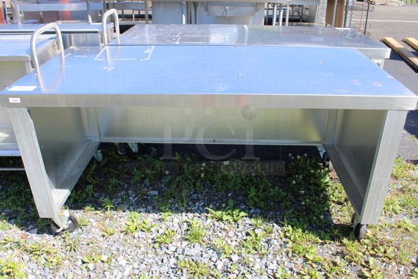 Stainless Steel Commercial Table on Commercial Casters. 62x29x30