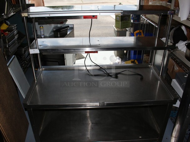 Eldorado SS Make Table on commercial casters with 2 Avantco heat lamps and a ticket holder rail