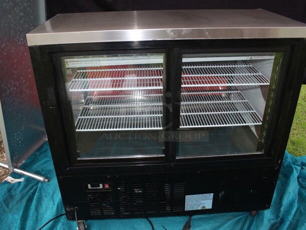 SUPER NICE Refrigerated display w/curved glass on commercial casters TESTED AND WORKING Model XDC120-8C  - Image 5 of 8
