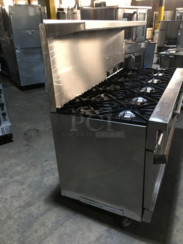 BEAUTIFUL! Vulcan Commercial Natural Gas Powered 10 Burner Stove! With Backsplash & Overhead Salamander Shelf! With 2 Full Size Ovens Underneath! On Commercial Casters! - Image 3 of 11
