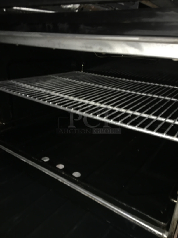 BEAUTIFUL! Sunfire Commercial Natural Gas Powered 6 Burner Stove! With Left Side Flat Griddle! With 2 Full Size Ovens Underneath! With Backsplash & Overhead Salamander Shelf! All Stainless Steel! On Casters! - Image 9 of 10