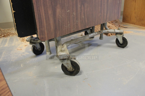 Wood Pattern Folding Table on Commercial Casters. 29.5x16x80. (Room 130) - Image 4 of 4