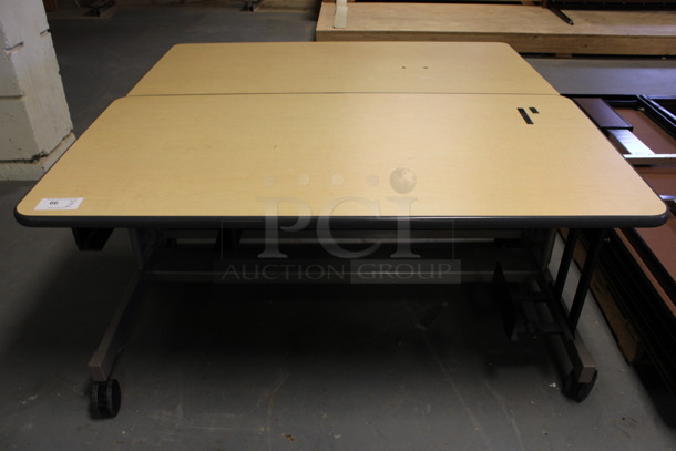 2 Wood Pattern Table on Casters. 60x30x27. 2 Times Your Bid! (Room 130) - Image 1 of 5