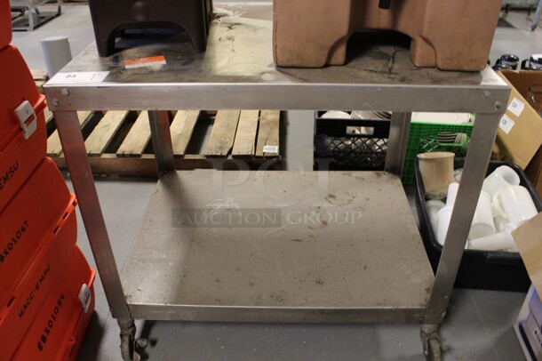 Metal 2 Tier Cart on Commercial Casters. 32.5x24.5x29.5. (Room 130)