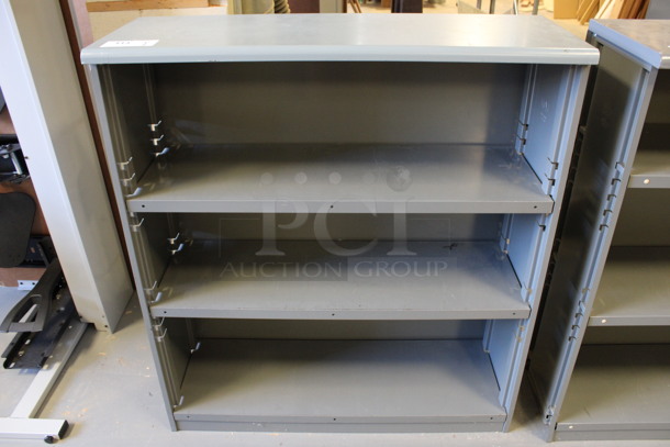 Gray Metal 3 Tier Bookshelf. 37.5x14.5x42. (Room 130)