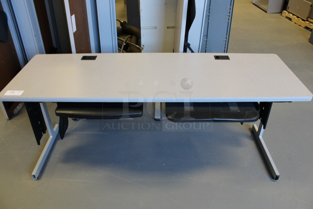 2 Gray Desks. Stock Picture - Cosmetic Condition May Vary. 71.5x23.5x29. 2 Times Your Bid! (Room 130)