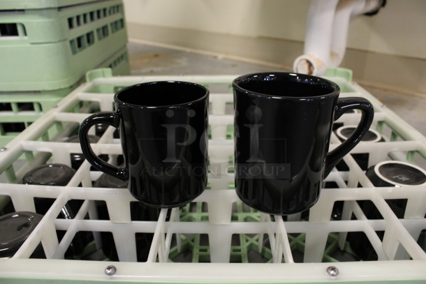 16 Black Mugs in Dish Caddy. 4x3x3.5, 4.5x3x4. 16 Times Your Bid! (Room 130)