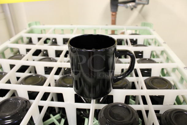 25 Black Mugs in Dish Caddy. 4x3x3.5. 25 Times Your Bid! (Room 130)