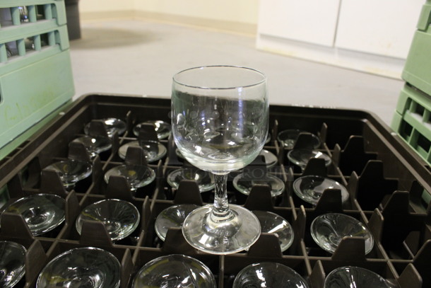 32 Wine Glasses in Dish Caddy. 2.75x2.75x5.25. 32 Times Your Bid! (Room 130)