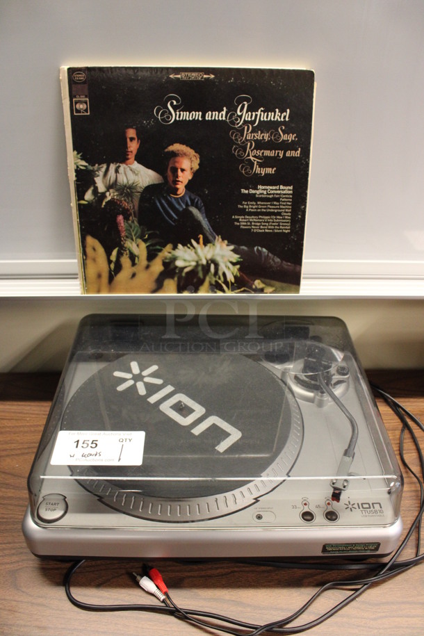 Ion Model TTUSB10 Countertop Record Player w/ 4 Records: Simon and Garfunkel, Peter Paul and Mary Reunion, Man of La Mancha and Synclavier II. 17.5x15x6. (2nd Floor: Room 220)